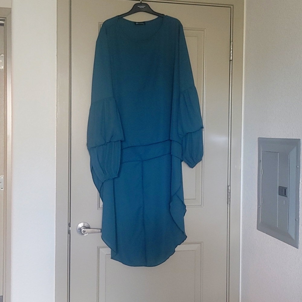A symmetrical forest green shirt
